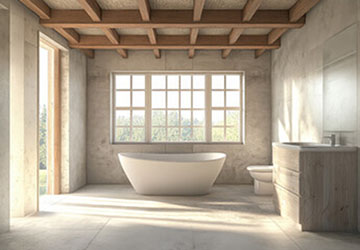 Modern bathroom with vaulted ceiling, standalone bath, and warm wood accents showcasing a completed high-quality renovation
